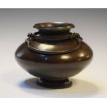 19th Century Chinese bronze vessel of squat baluster form having a double swing handle Condition: