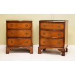 Pair of reproduction mahogany serpentine front chests, each fitted three drawers and standing on