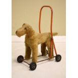 Triang push along toy dog, the dog bearing fabric label marked 'International Model Aircraft