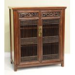 Reproduction Chinese hardwood cupboard fitted three shelves enclosed by a pair of doors, each having