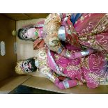 Two Eastern puppets, each having embroidered and sequinned clothing Condition: