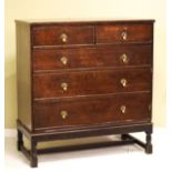 Early 20th Century oak chest of two short and three long graduated drawers on turned supports