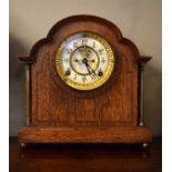 Early 20th Century inlaid oak cased mantel clock, the off-white dial with Arabic numerals and