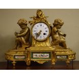 19th Century French ormolu figural cased mantel clock, the case decorated with two seated cherubs,
