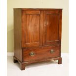 Mahogany two door cupboard having a fall flap below and standing on bracket feet Condition: