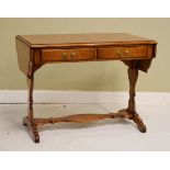 Reproduction walnut and mahogany two flap occasional table fitted two drawers and standing on