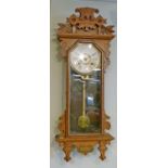 Late 19th/early 20th Century American carved oak cased wall clock by the Ansonia Clock Company,