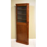 Early 20th Century mahogany floor standing corner display cabinet, the upper section fitted three