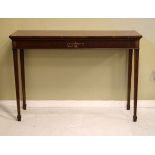 Reproduction mahogany serving table raised on square tapered supports terminating in spade feet (