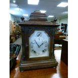 Early 20th Century mahogany cased mantel clock, the silvered dial with Roman numerals and subsidiary