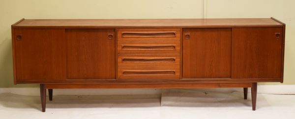 Late 1960's/early 1970's period teak Long John type sideboard fitted four sliding doors with three