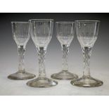 18th Century style wine glass having a facet cut bowl, diamond cut stem and standing on a conical