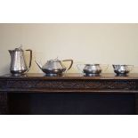 An Arts & Crafts design Roundhead hammered pewter four piece tea set Condition: