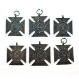 Six hallmarked silver Maltese Cross design sporting medallions having monogram CSS with crest, the