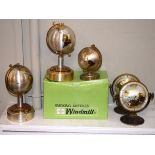 Two Estima Globe design mantel clocks, a similar 'Rhythm' globe design clock and three globe