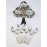 White metal three piece condiment set and stand together with various white metal spoons Condition: