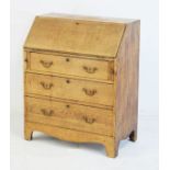 Small 19th Century oak bureau, the fall flap enclosing a fitted interior, three long graduated