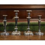 Two pairs of silver plated candlesticks Condition: