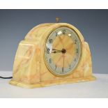 1930's period mottled yellow Bakelite cased mantel clock, the dial with Arabic numerals Condition: