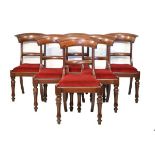 Set of six Victorian mahogany yoke back dining chairs, each having a drop-in seat and standing on