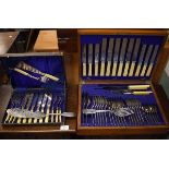 Silver plated canteen of cutlery in an oak case, pair of silver plated fish servers and a set of