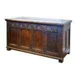 18th Century oak coffer, the four panel front having a carved frieze Condition: