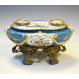 19th Century French porcelain inkstand having foliate reserves on a blue ground, cast brass base
