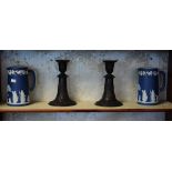 Pair of 20th Century Wedgwood black basalt candlesticks, together with two jasperware jugs