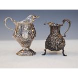 George II silver baluster shaped cream jug having later embossed decoration and standing on triple