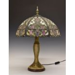 Decorative reproduction table lamp having a stained and leaded glass style shade Condition: