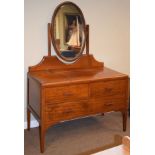 Early 20th Century mahogany and string inlaid dressing table, the raised back having an oval swing