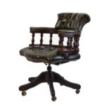 Reproduction mahogany finish framed tub shaped swivel desk chair upholstered in deep buttoned