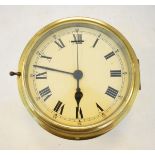 Brass cased ships clock, the off-white dial with Roman and Arabic numerals Condition: