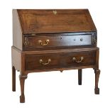 Late 18th/early 19th Century oak bureau, the fall flap opening to reveal a fitted interior, the base