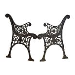 Pair of early 20th Century cast iron garden bench ends, each having Neo Classical decoration