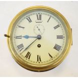 Brass cased ships bulk head clock, the off-white dial with Roman numerals and subsidiary seconds