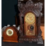Late 19th/early 20th Century Haven Clock Company 'Gingerbread' cased mantel clock, together with