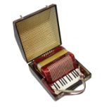 Hohner Student II accordion having red case and faux crocodile carry case Condition: