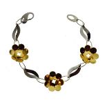 White and gold coloured metal bracelet set three flowerhead design links, stamped 750 Condition: