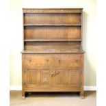 Mid 20th Century oak dresser, the plate rack fitted two shelves with carved frieze, the base