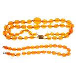 Triple strand necklace of faceted amber coloured beads Condition: