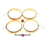 Four rolled gold engraved snap bangles, 9ct gold shirt stud and a rolled gold bar brooch Condition: