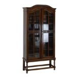 Early 20th Century oak bookcase fitted two glazed doors on barley twist supports Condition: