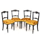 Set of four Victorian Aesthetic movement ebonised and incised decorated dining chairs having stuff-