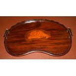 Edwardian mahogany and marquetry decorated kidney shaped two handled tea tray having central shell