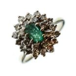 Emerald and diamond cluster dress ring, the shank indistinctly marked, size P½ Condition: