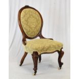 Victorian walnut framed salon chair, the oval back and seat having oatmeal coloured fabric, raised