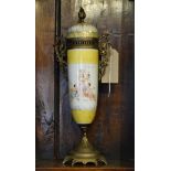 Early 20th Century tapered cylindrical ceramic vase and cover having brass mounts Condition: