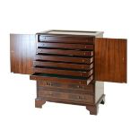 Reproduction mahogany collectors cabinet fitted seven green baize lined drawers enclosed by a pair