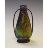 Iridescent art glass vase in a pewter two handled frame Condition: